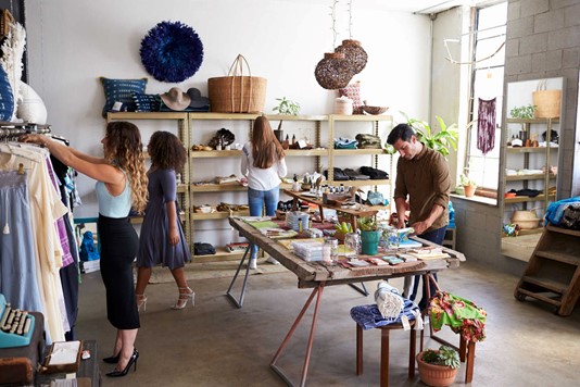 Customers and staff busy in a clothing shop