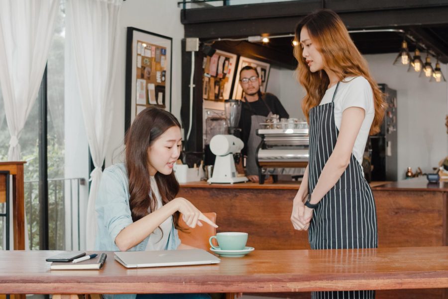 Barista hears complaint from coffee shop customer