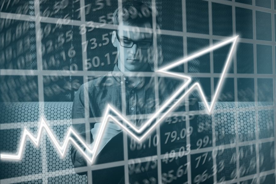 Black and white silouhette of a man with a bar chart and numbers